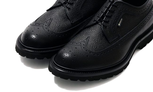 closeup on black wingtip shoes