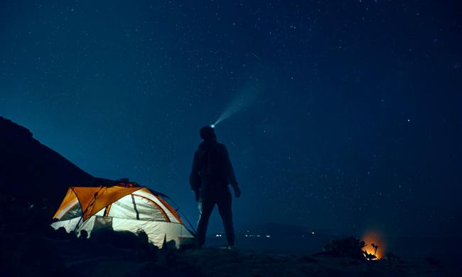 Man at a campground stargazing